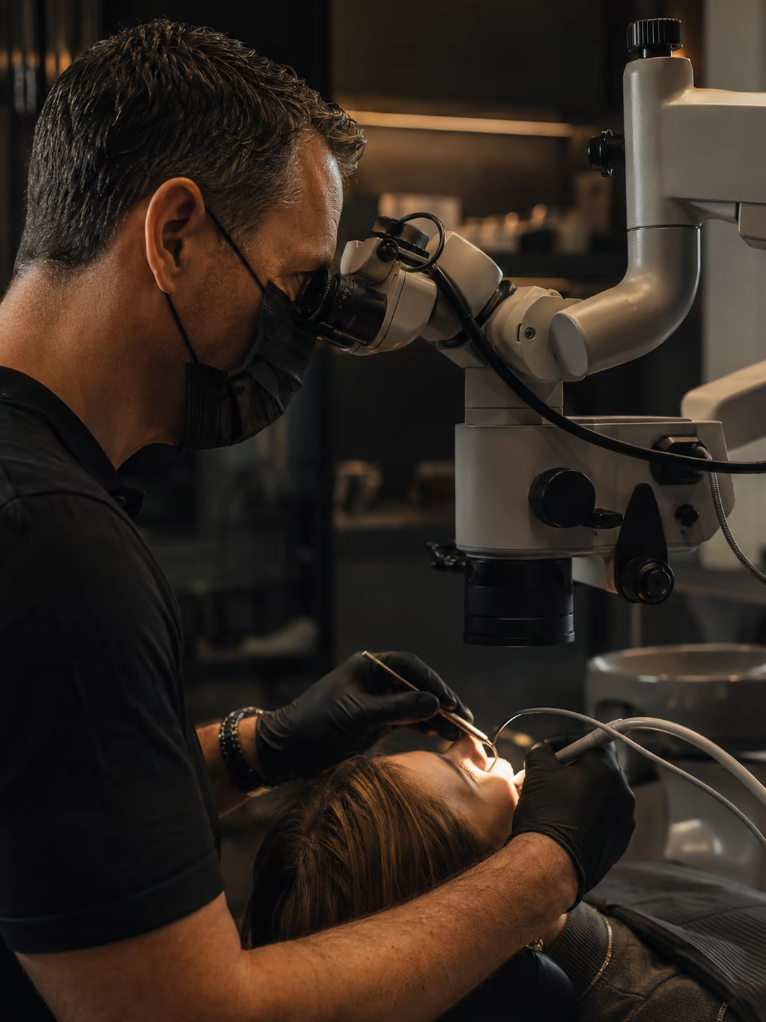 Dental treatment under an operating microscope
